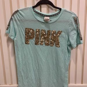 Teal Pink shirt with gold sequined lettering.